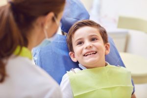 little boy at the dentist smiling