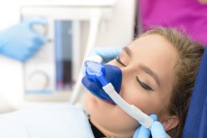 A woman is under sedation dentistry